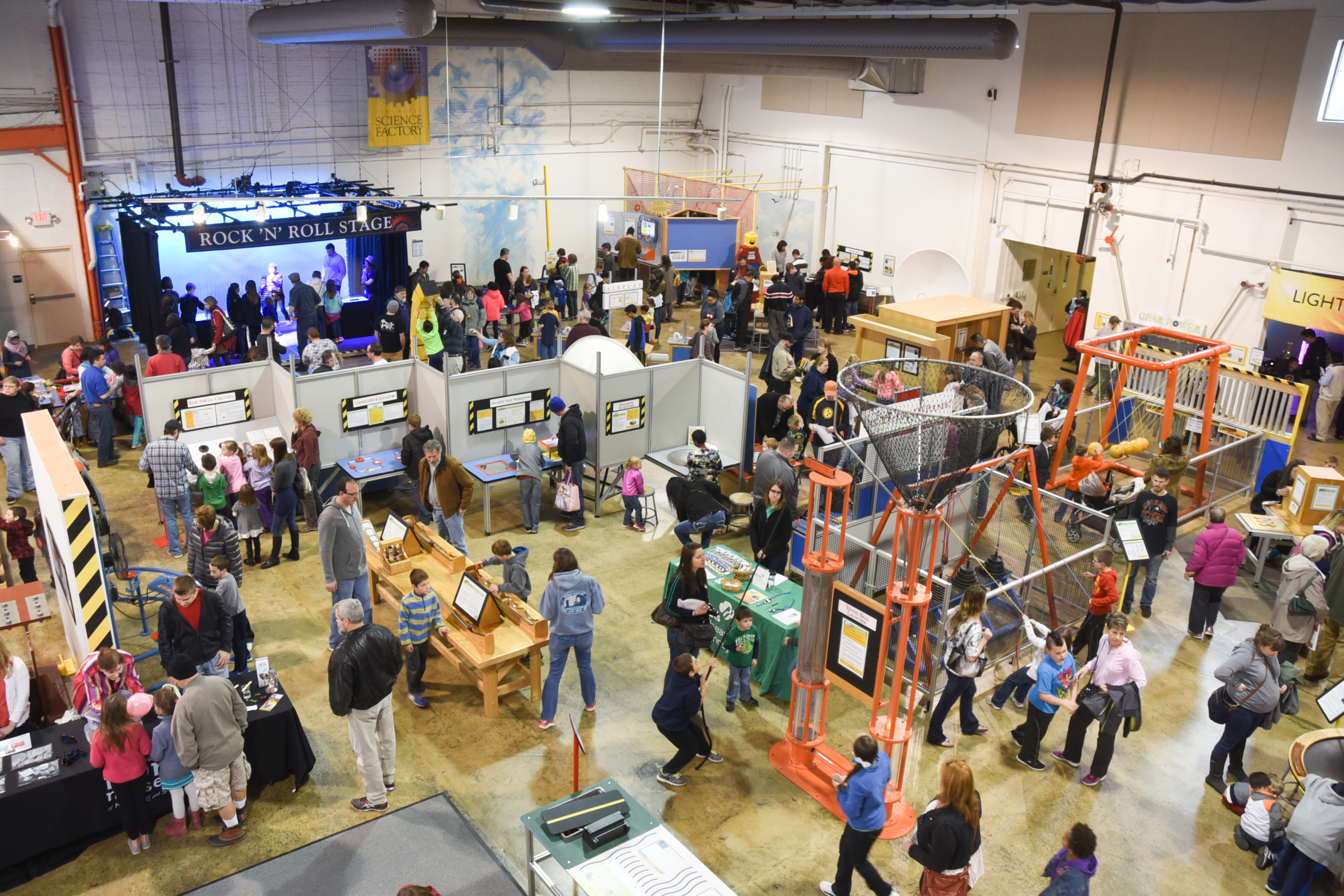 Many people enjoying a variety of exhibits at the Lancaster Science Factory